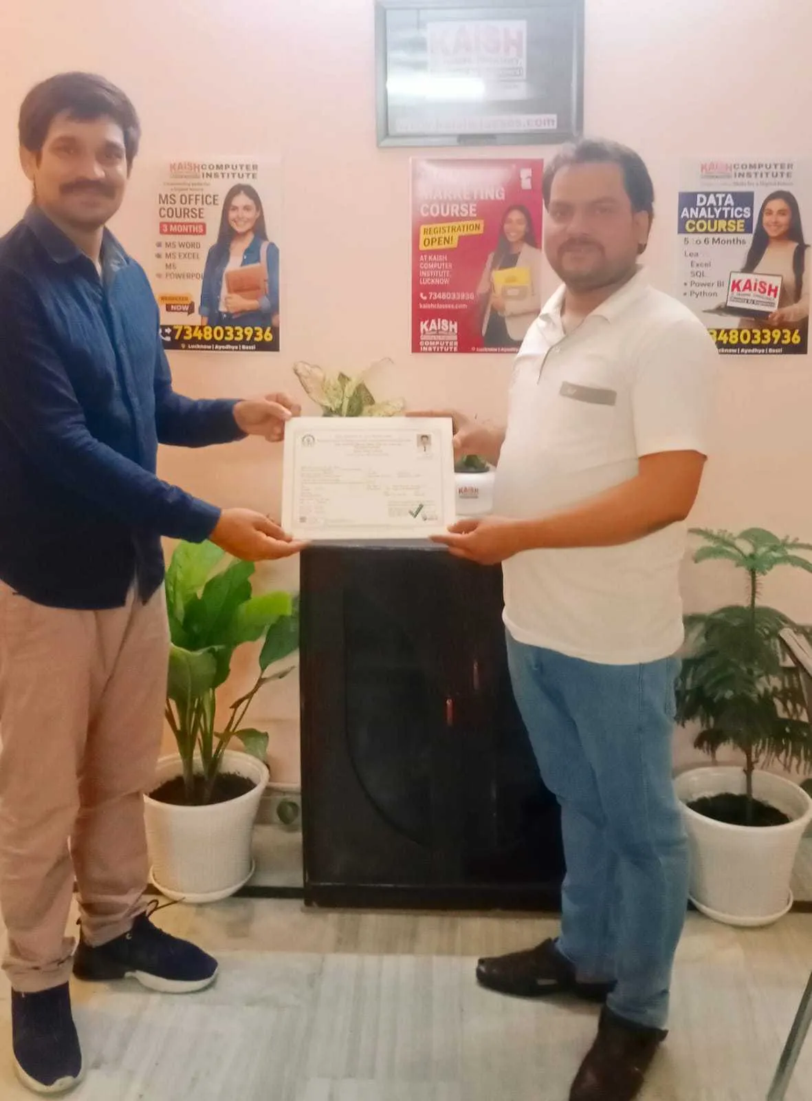 Student receiving computer course completion certificate at KAiSH Computer Institute Aliganj Lucknow after successful training